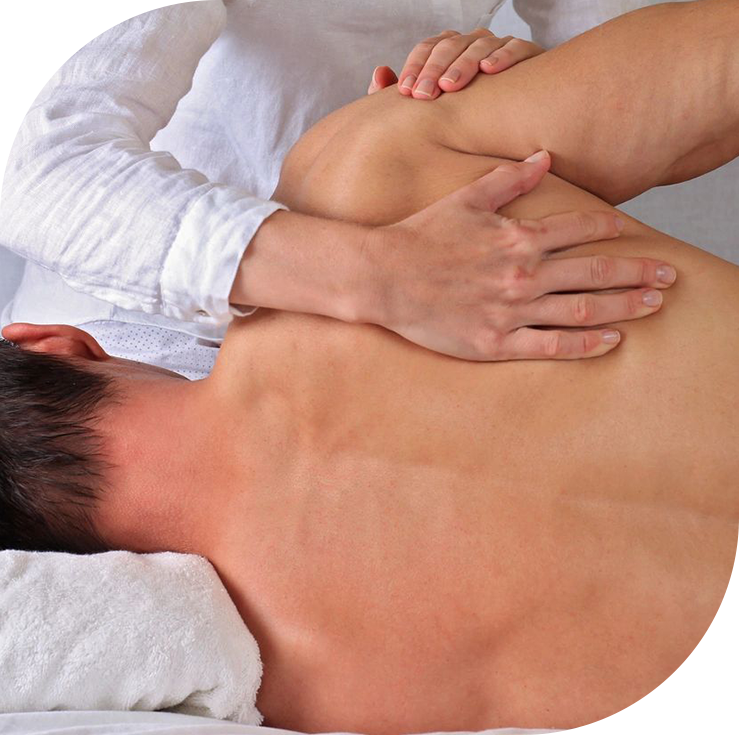 A person is getting their back checked by a masseuse.